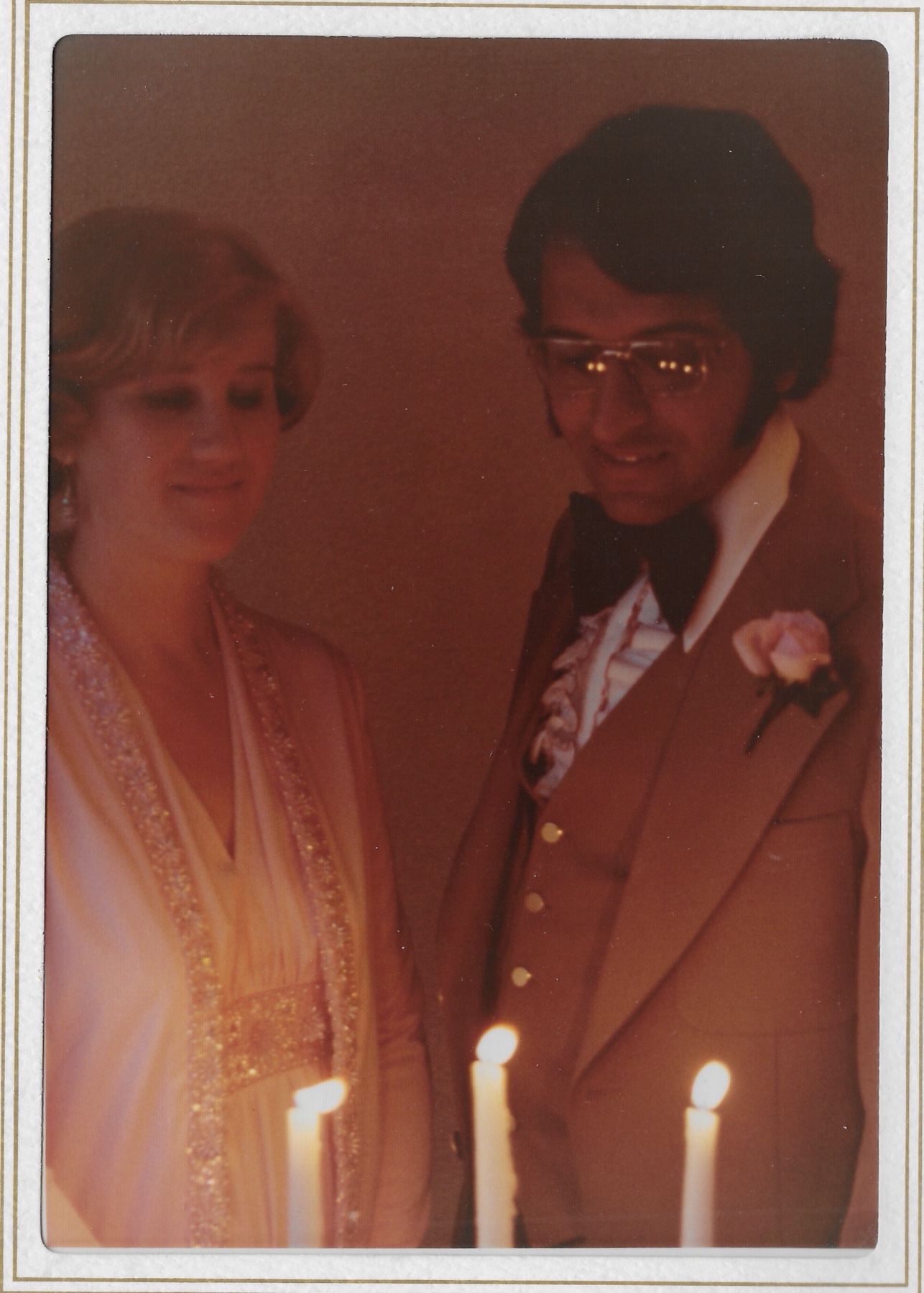 Mary Lee and Madhu together beside the candles